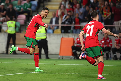 Cristiano Ronaldo celebrates after scoring a goal against Ireland